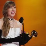 Taylor Swift receives an award at the 2024 Grammy Awards on February 4 in Los Angeles