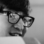 John Lennon with a Cordoban hat, bullfighter's cape and wrench in his second book of 'nonsense'