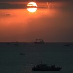 The sun sets behind a Philippine