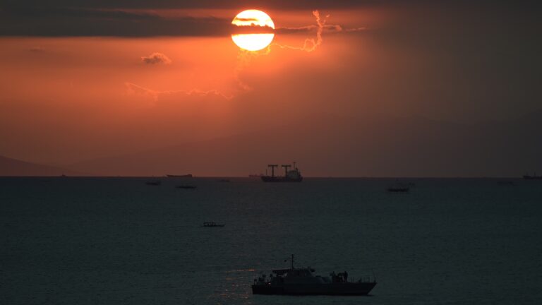 The sun sets behind a Philippine